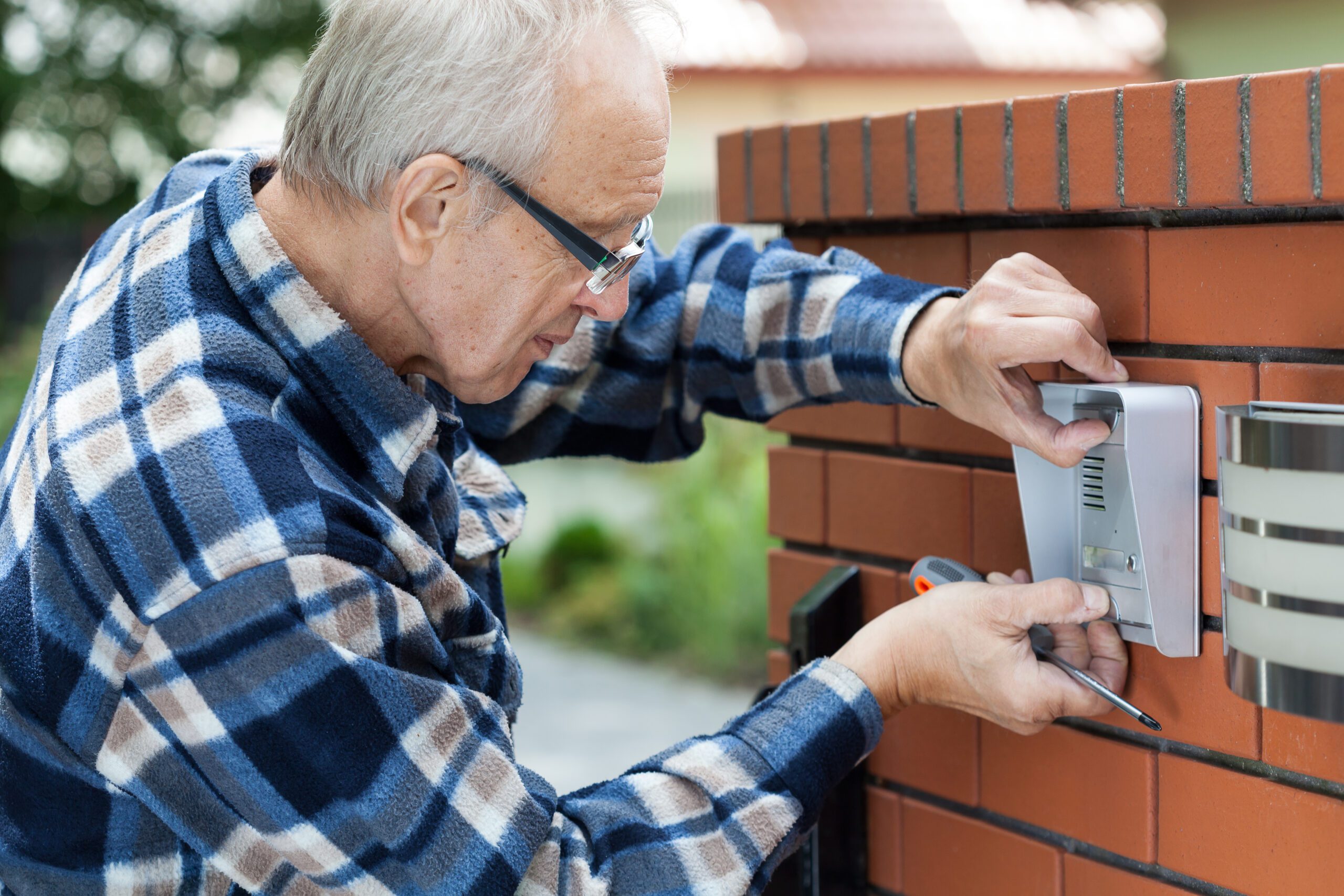 Handyman installing intercom