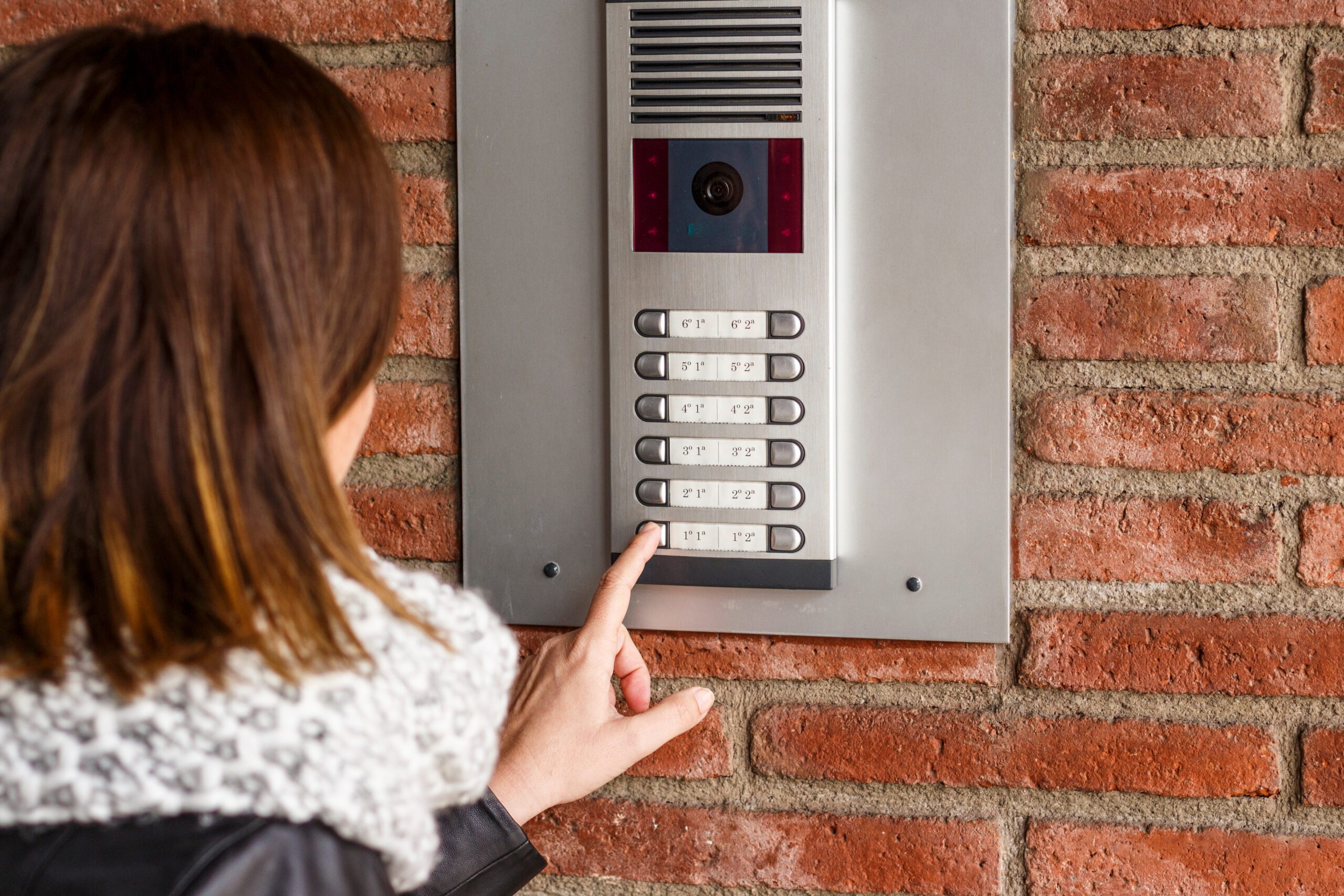 Woman talking on the intercom