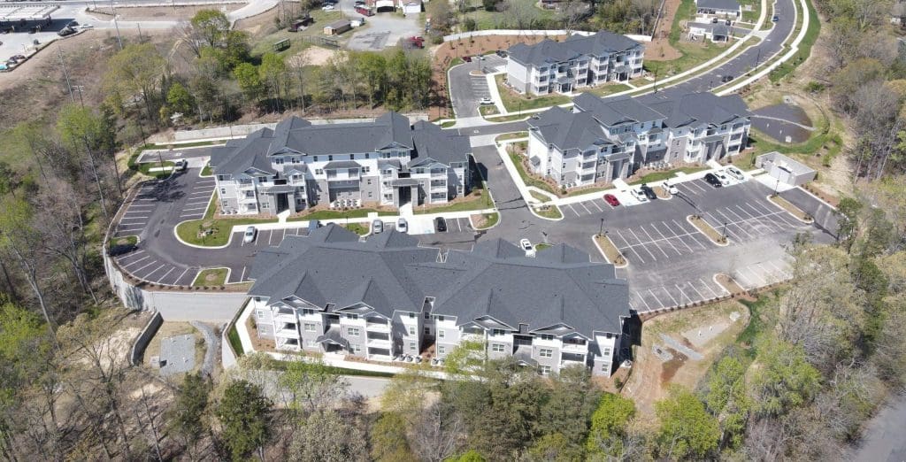 Aerial view of Abbington on Mount Holly in Charlotte, apartment buildings around their car parking.