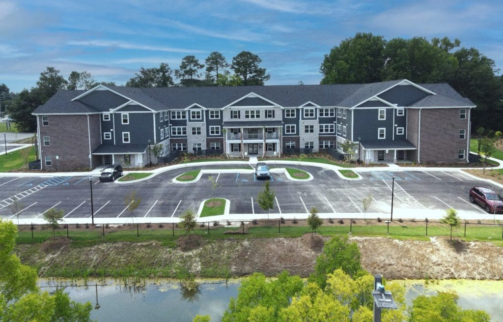 The Villas at Northlake in Lexington, South Carolina, a three-storey apartment building behind its car park.